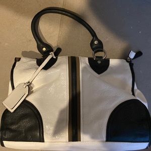 This cute black and white purse with a tan stripe.
